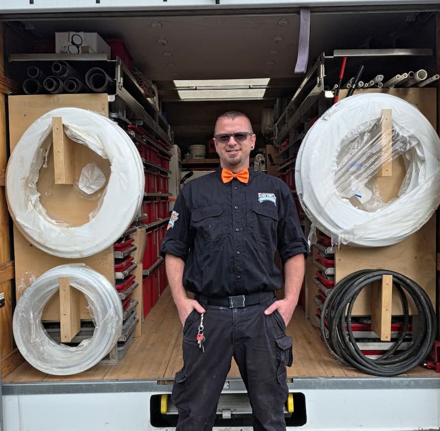 Da Vinci’s Best Plumbing owner standing in front of a stocked plumbing service truck